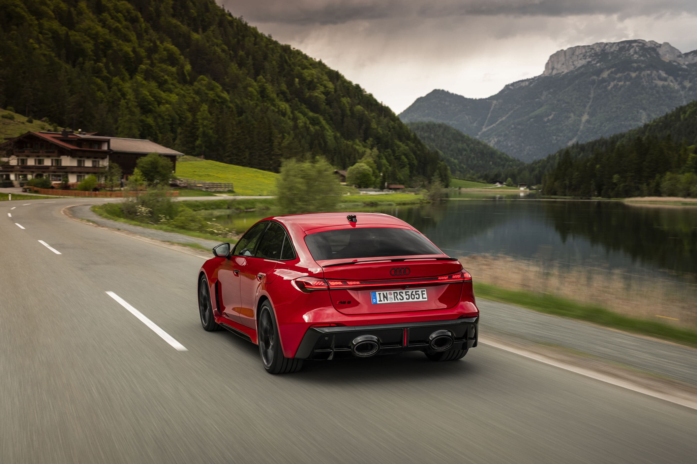 RS 5 Sedan rear three-quarter — the much-discussed oversized exhaust tips visible, but in context the bodywork carries them.