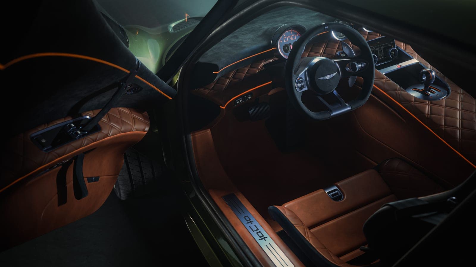 Inside the Magma GT, a twin-cockpit cabin in cognac leather, with an analog cluster and three centre-console dials drawn from motor-racing timekeeping.