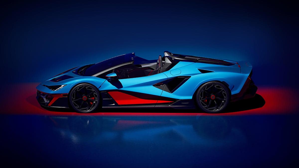 The Fenomeno Roadster strips away the coupe's roof while preserving its aggression, finished in Blu Cepheus with Rosso Mars accents.